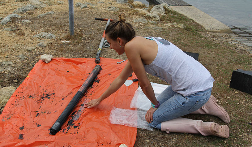 woman measuring with a ruler on an orange plastic mat