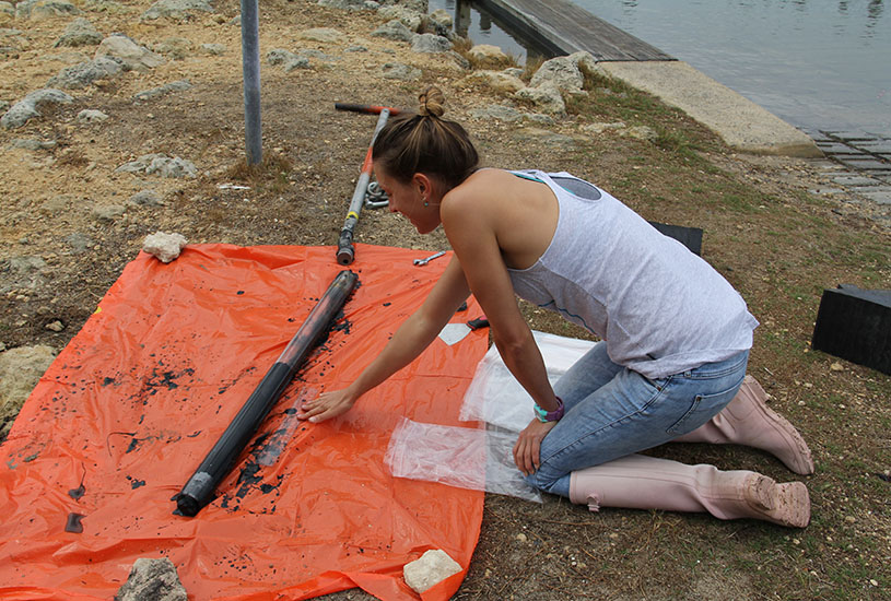 woman measuring with a ruler on an orange plastic mat