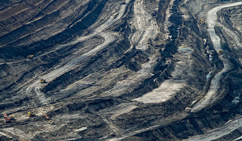 coal mining area with large vehicles traveling across