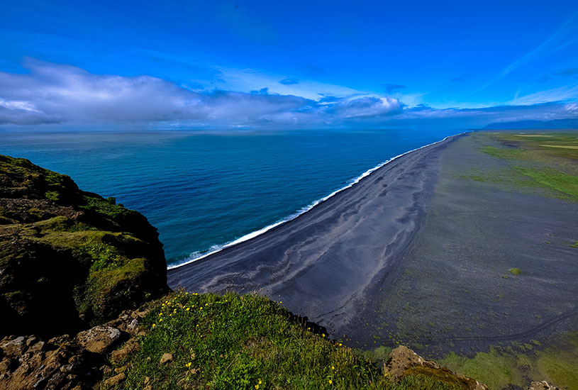 view of the beach on top of a mountain