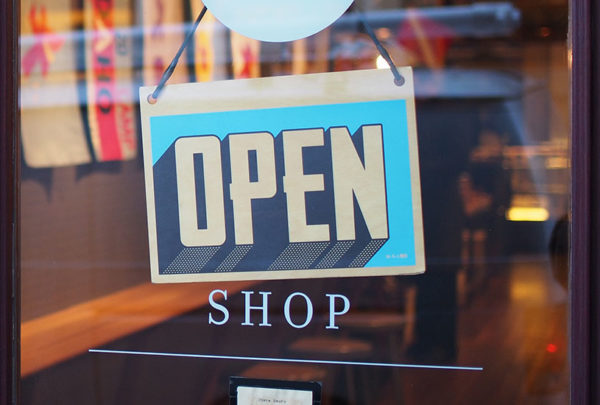open sign in a door for a shop