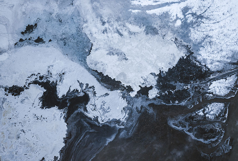 A birds eye view of an ice capped landscape.