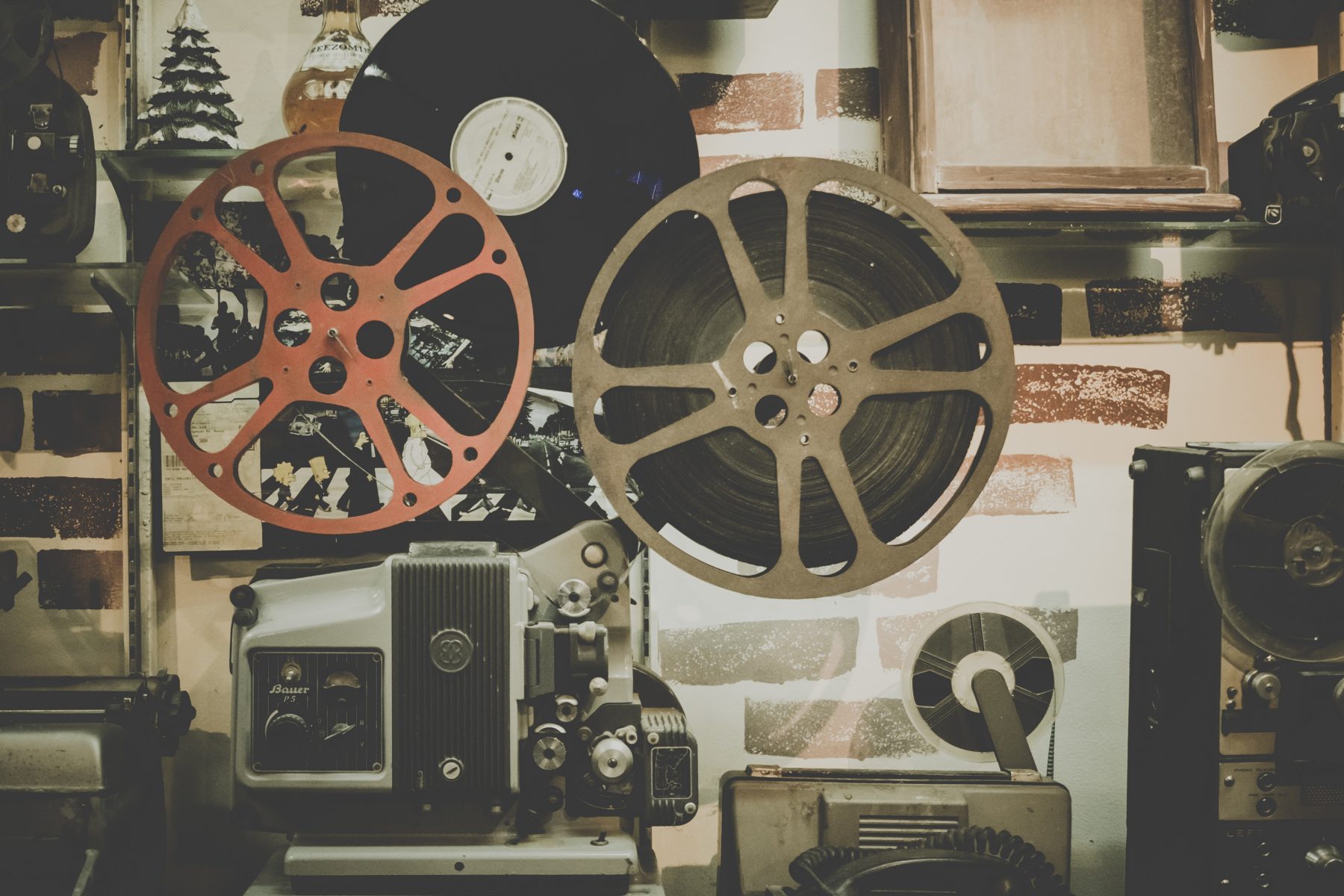 A reel of film being played in a cinematographer's room.