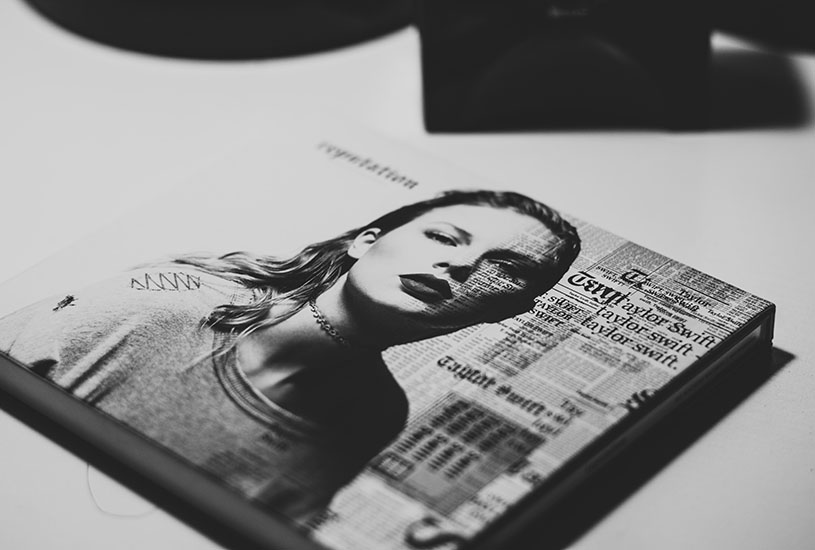 Taylor Swift's reputation album on a desk.
