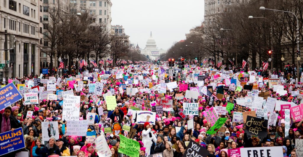 A group of protestors marching towards the White House in Washington D.C. during the Women's March 2017.