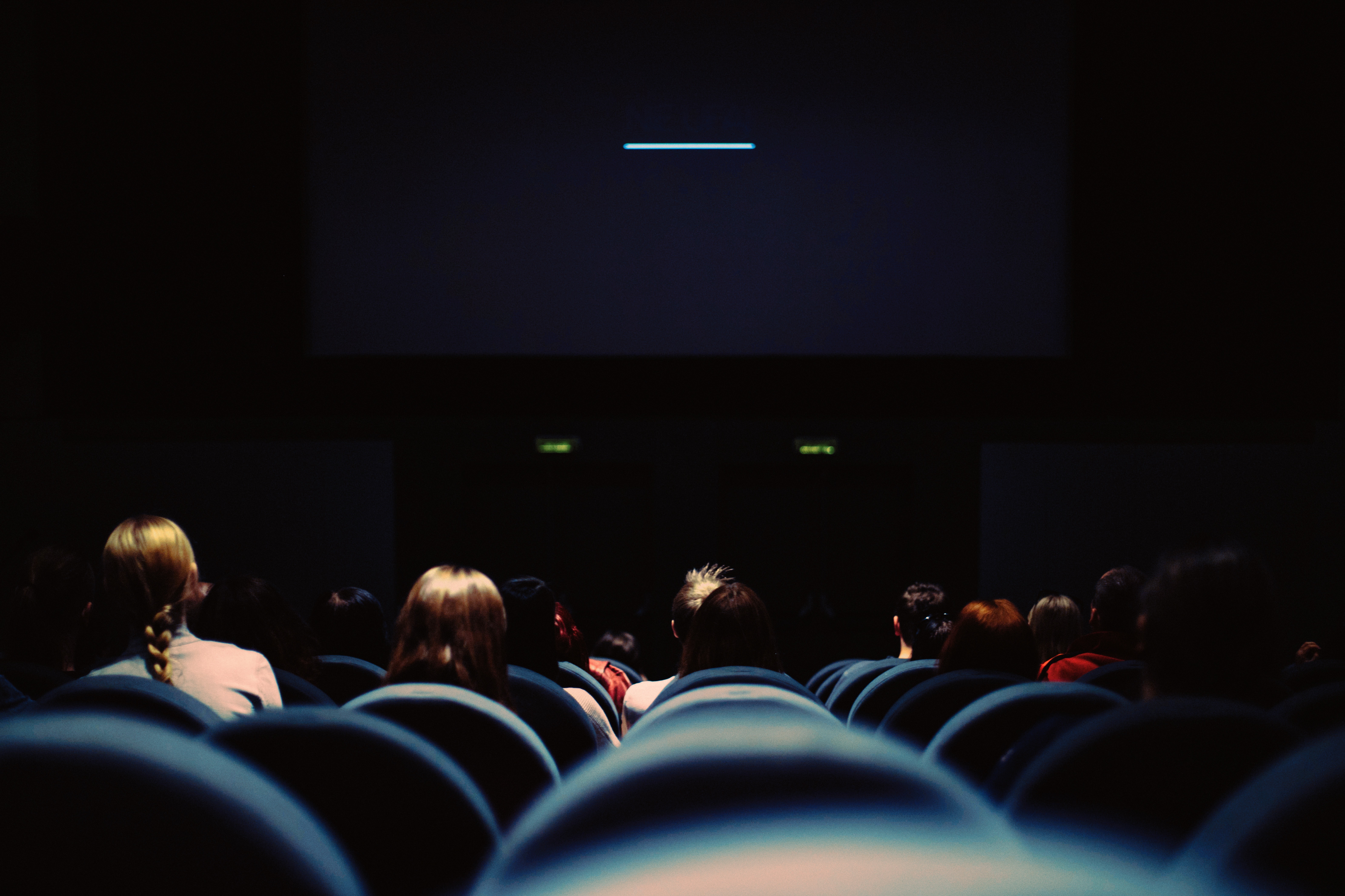 An audience watching a film in a cinema.