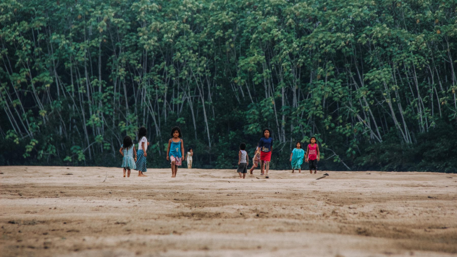 Local children walking through the Amazon.
