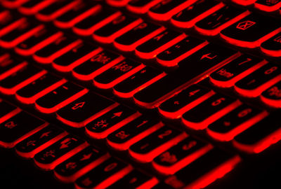 A keyboard lit up in red neon.