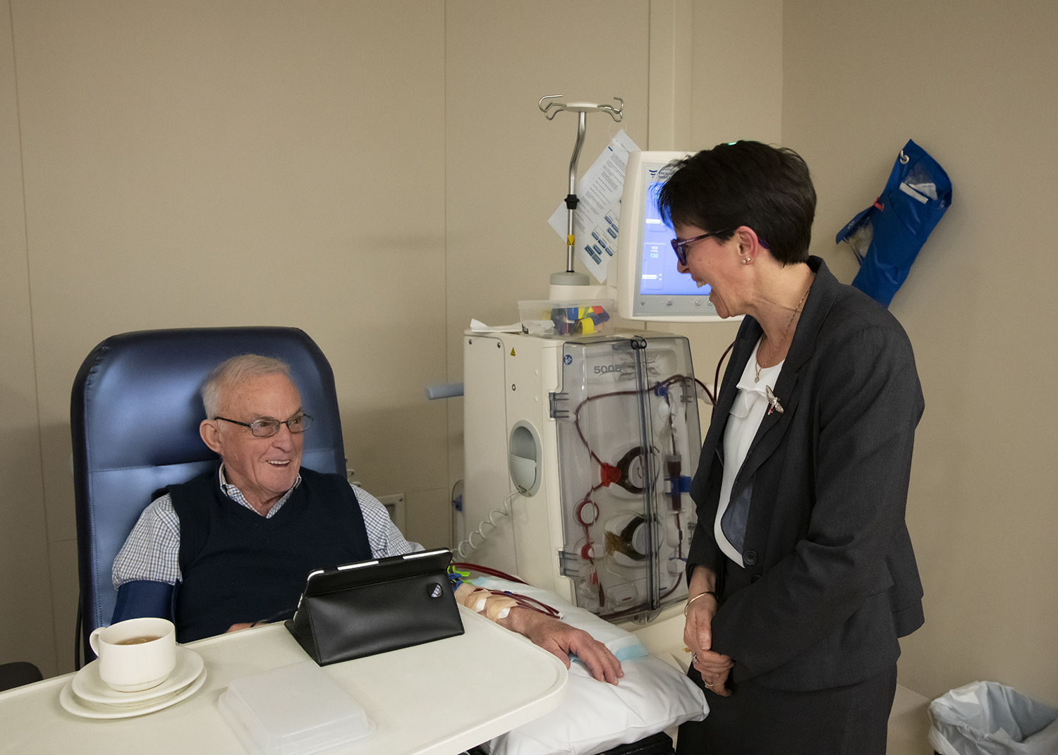Professor Karen Dwyer with a patient in a ward.
