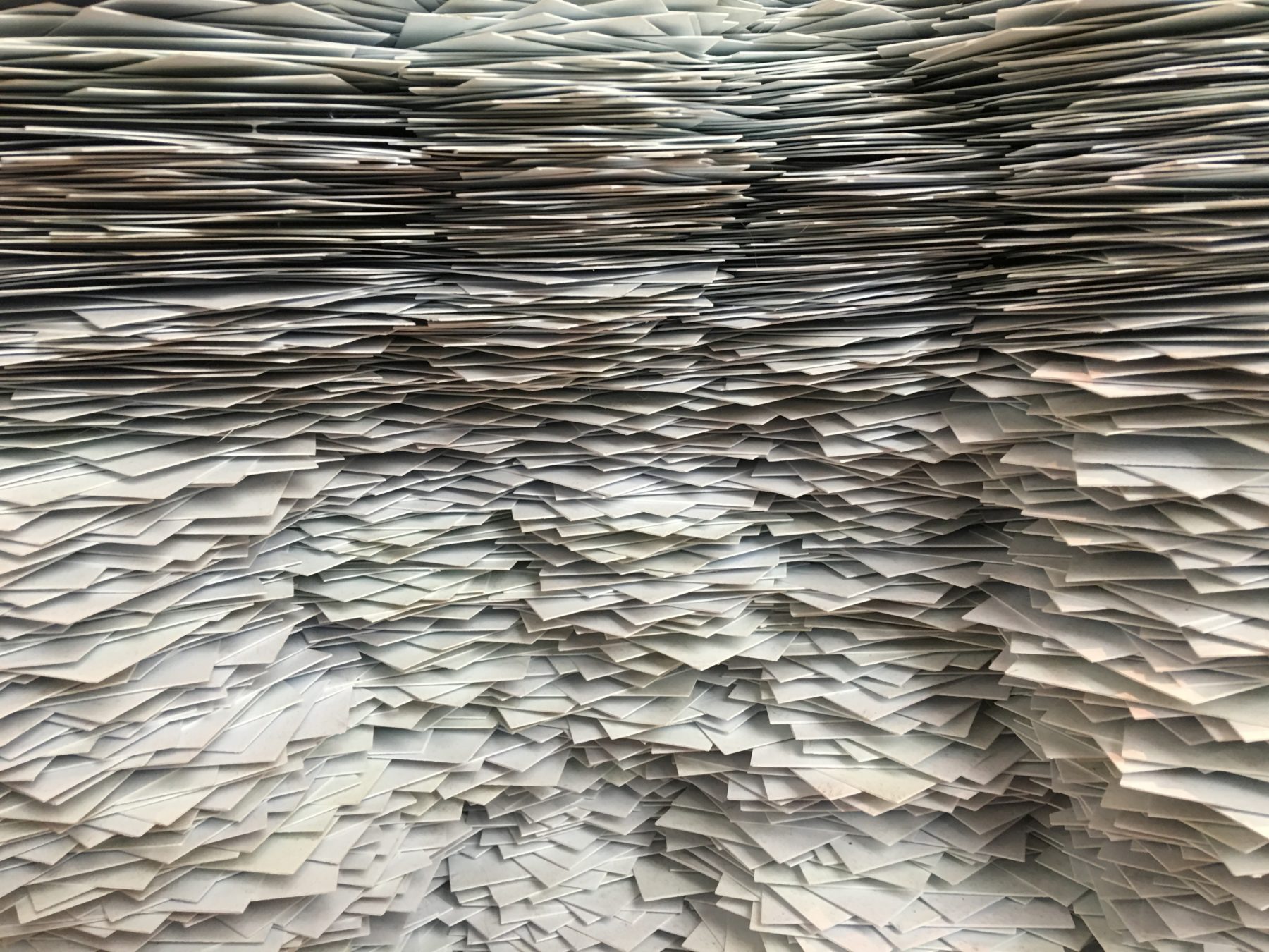 An exhibition in Washington DC displaying a mass stack of papers.
