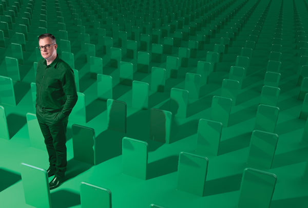 Patrick Stokes standing in a green, digital graveyard.