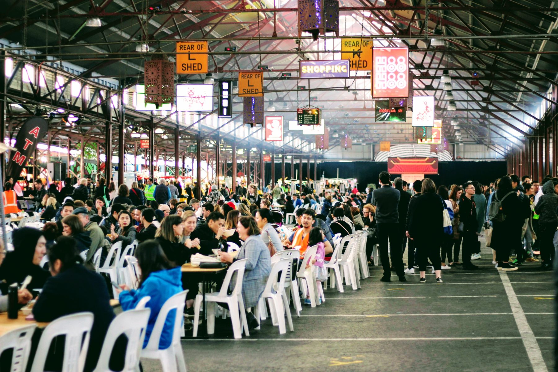 A group of people eating at Melbourne's Vic Market.