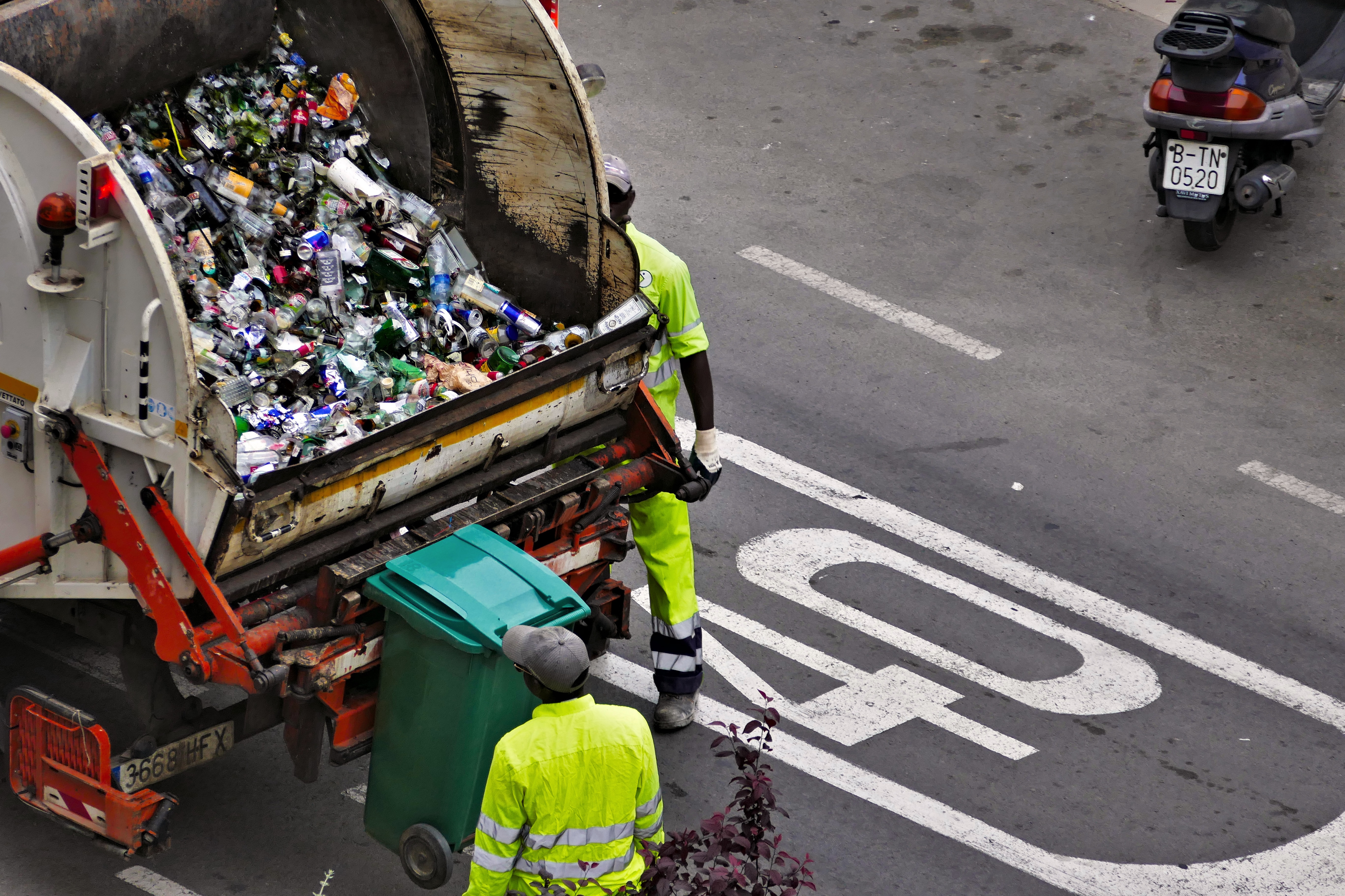 Waste being collected in a garbage truck.