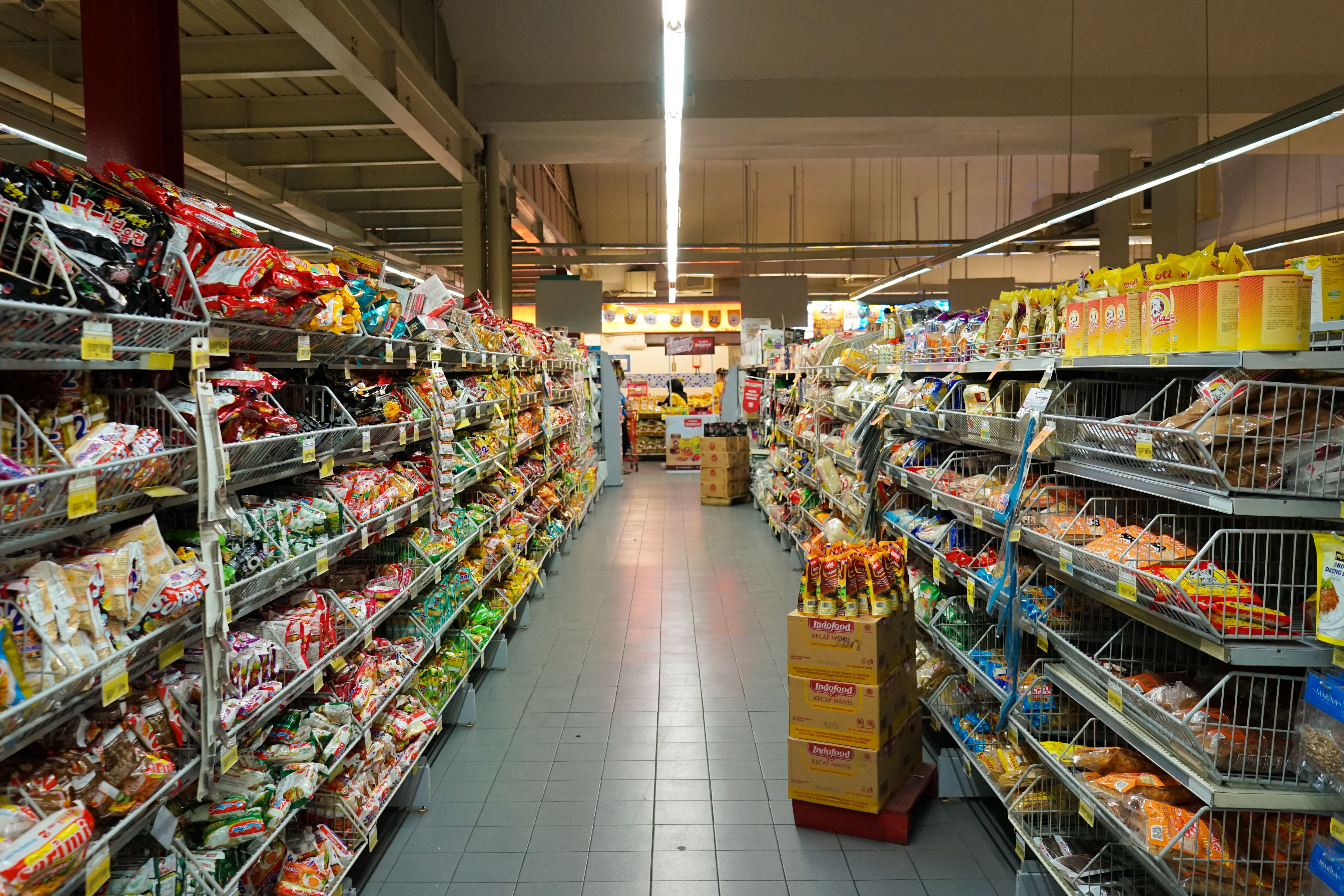 An aisle down a supermarket.