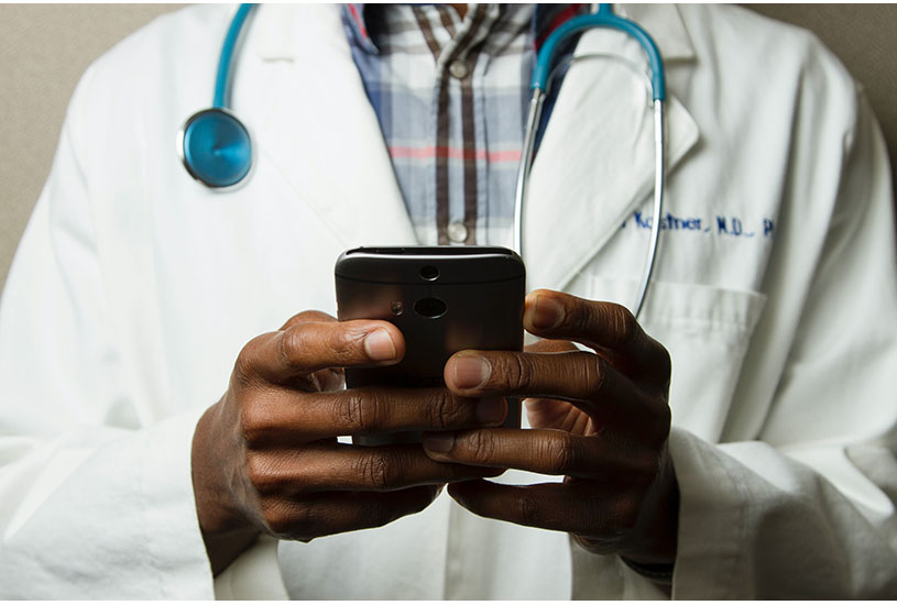 Image of a doctor holding a smartphone