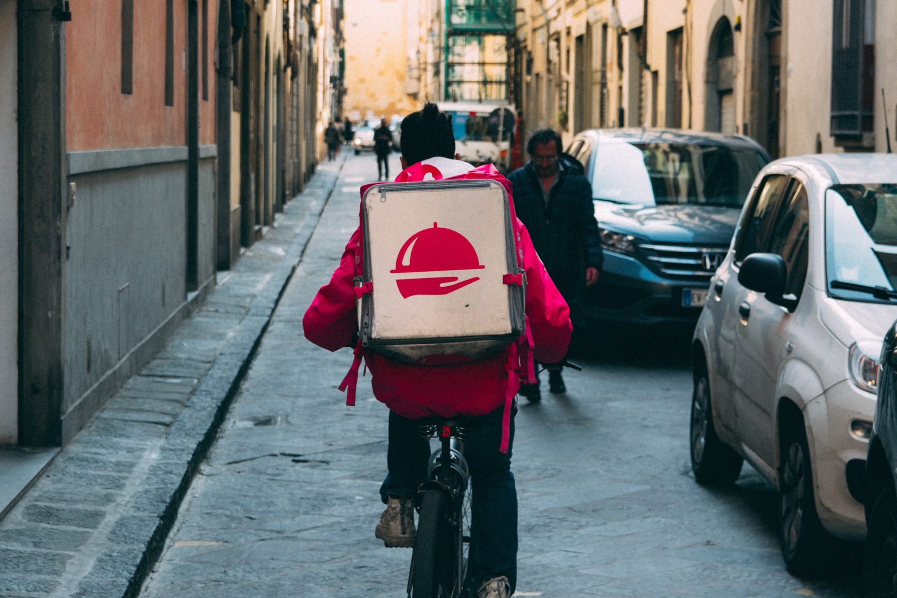 Image of person delivering food on a bicycle 