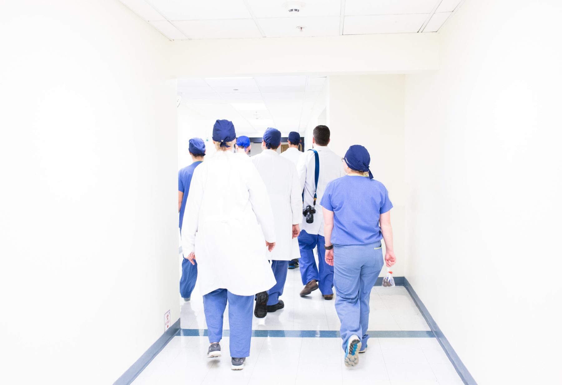 Image of doctors walking through a hallway