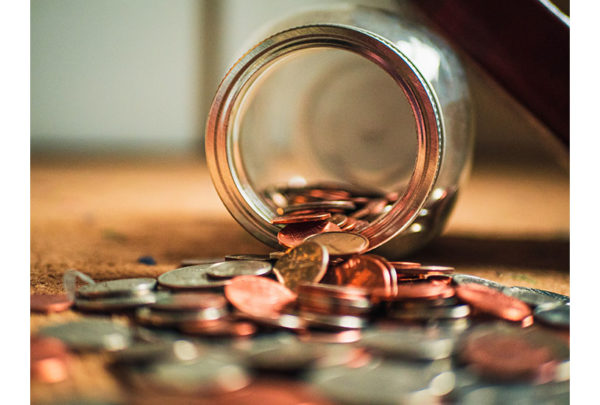 Image of upturned jar of coins