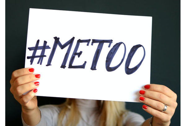 Image of woman holding a #MeToo sign