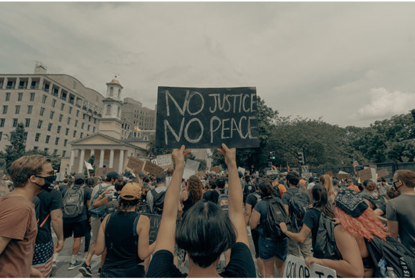Image of sign that reads no justice, no peace