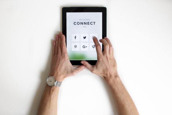 Image of a computer tablet with links to social media outlets